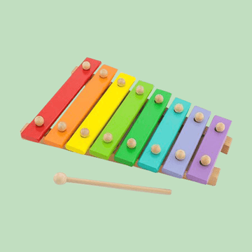 Colorful wooden xylophone toy with eight rainbow-colored bars and a wooden mallet on a light green background.