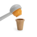 Wooden ice cream scoop lifting a wooden ice cream ball, part of the Jumbo Wooden Ice Cream Cart Stall Play Set by PolarB, designed for realistic pretend play.